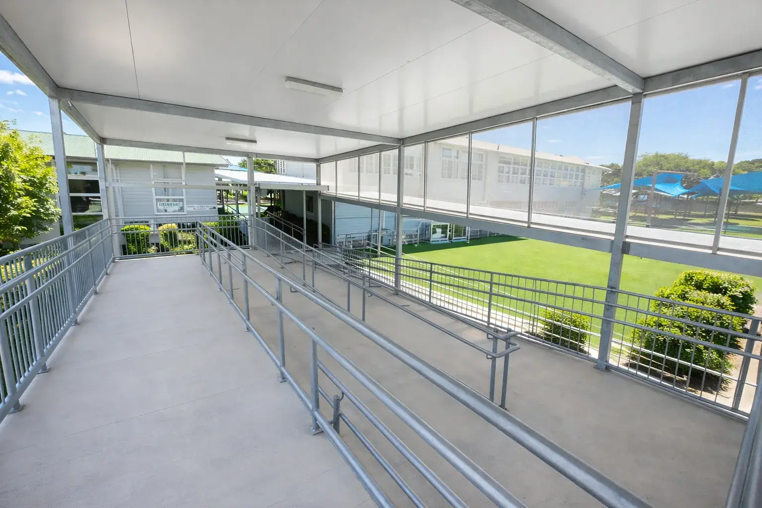 Durable structural steel design for educational facility walkways at Oxley State School.